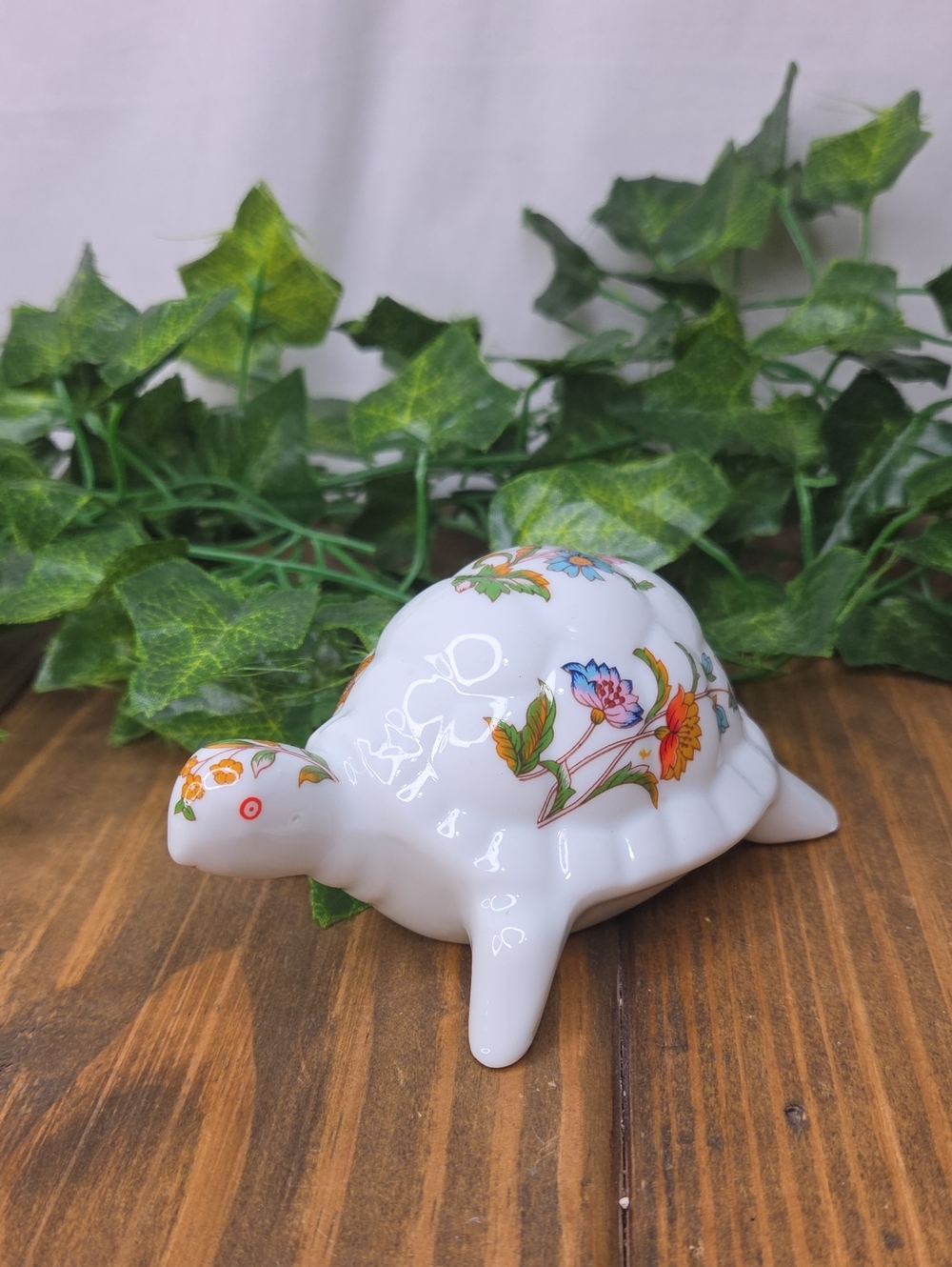 Trina. Porcelain Floral Turtle Figurine. White with Multicolor Floral Pattern.